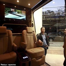 Driving commuters around the Benz: New York City's wealthiest enjoy hidden luxury in Mercedes vans that take up half the road