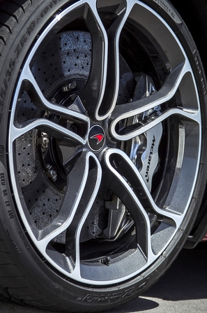 The wheels have a diamond-cut finish with chrome highlights and black details