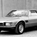 In the 80s, De Tomaso created the Longchamp with a front-mounted Ford V8