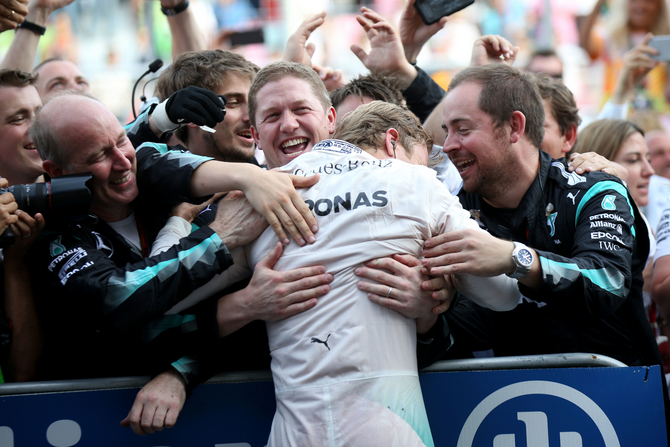 Rosberg celebrates with the teamat the end of the first ever Grand Prix to be held in Baku