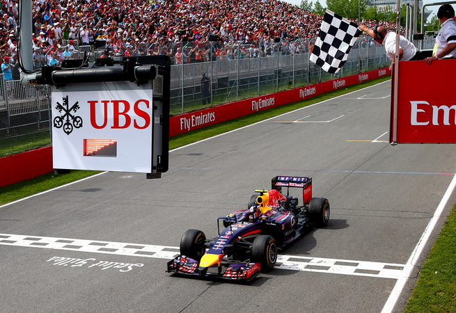 Ricciardo crossing the finish line in first place