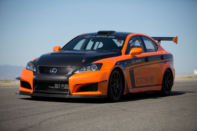 The car is painted Orange Mica with bare carbon fiber